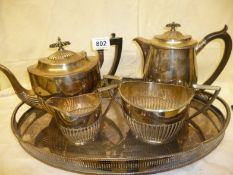 A 3 piece silver plated tea set, tray and water jug