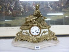 A solid brass French mantel clock surmounted figure