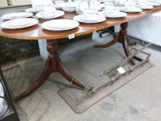 An extending mahogany dining table