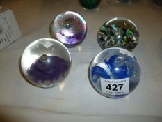 3 Caithness paperweights being 'Tempest', Titania' and 'Sentinal' and one unmarked