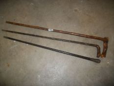 3 old walking sticks