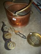 A copper scuttle, horse brasses, coal tongs etc