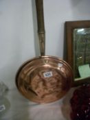 A copper warming pan