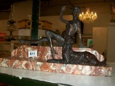 A bronze 'Flapper' girl figure with dog on marble base