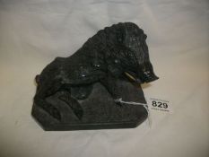 A carved wild boar (possibly coal)