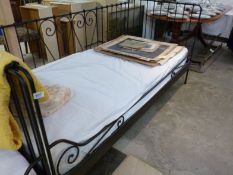 A metal framed studio bed