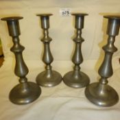 A matching set of 4 early 20th centure pewter candlesticks