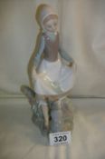 A Lladro girl with rabbit