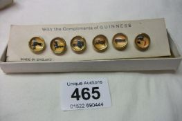 A set of 6 Guiness shirt buttons, (circa 1960's)