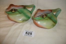 A pair of unusual pottery 'Frog' jugs