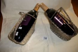 2 silver plated wine bottle holders with wine