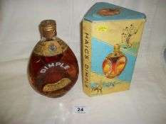 A boxed bottle of Haig Dimple Whisky