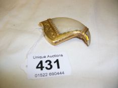 A tiger claw brooch/pendant stamped Wilcock Durban