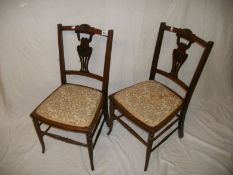 A pair of mahogany inlaid chairs