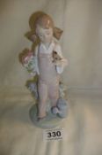 A Lladro girl with chaffinch