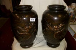 A pair of bronze vases decorated with dragons