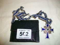 A WW2 German cross of honor (The German Mother silver award for bearing 6 - 7 children)