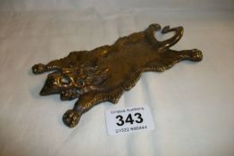 A Bronze Bergman style 'taxidermy' lion skin rug paperweight