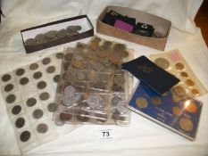 A collection of mixed coins including crowns