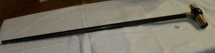 A walking stick with brass telescope in handle