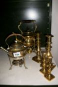 A brass kettle on stand, plated kettle on stand and 2 pairs of brass candlesitcks