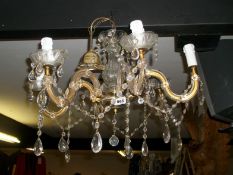 A 6 arm glass chandelier