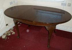 An oval mahogany table