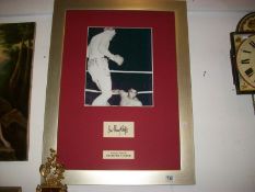 A framed picture of Henry Cooper and Mohamed Ali, signed by Henry Cooper and with certificate on