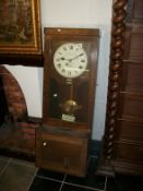 An old clocking in clock by Gledhill Brook, glass a/f