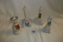 A crested china Skegness clock tower, Scarborough sun dial, Blackpool Tower and  Woodhouse Cross