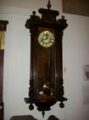 A Victorian mahogany wall clock (case has had woodworm)