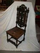 A heavily carved hall chair