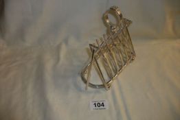 A silver plates toast rack with cricketing theme