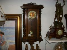 A Victorian mahogany wall clock