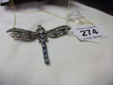A large dragonfly pendant set with 3ct old cut diamonds, opal, rubies and sapphires
