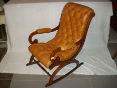 An old leather covered rocking chair