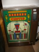 An old Cuptie amusement machine a/f