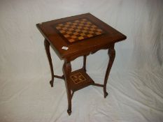 A mahogany table inlaid with chess board