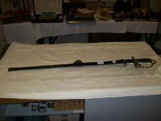 An old sword with brass hilt and scabbard