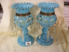 A pair of Victorian blue glass lustres (26cm) missing some droppers