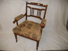 An Edwardian oak hall chair