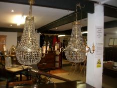 A pair of good basket chandeliers and spares