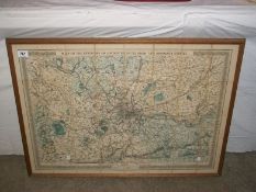 A framed map of the environs of London, produced from the Ordnance survey, 85cm x 61cm