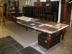 A Victorian mahogany wind out table with 5 leaves