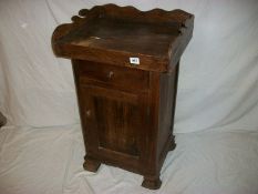 An oak pantry cabinet