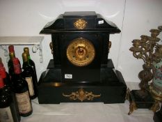 A black marble clock