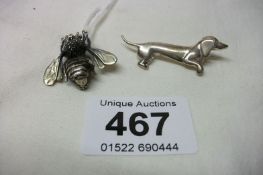 A silver bee brooch and a silver dachsund brooch