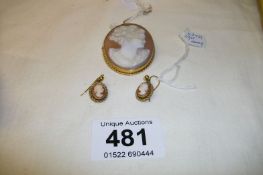 A 9ct gold cameo brooch and earrings