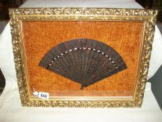 A cased early 19th century finely carved tortoise shell fan