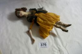 An early 1900's doll with wax head,  arm a/f